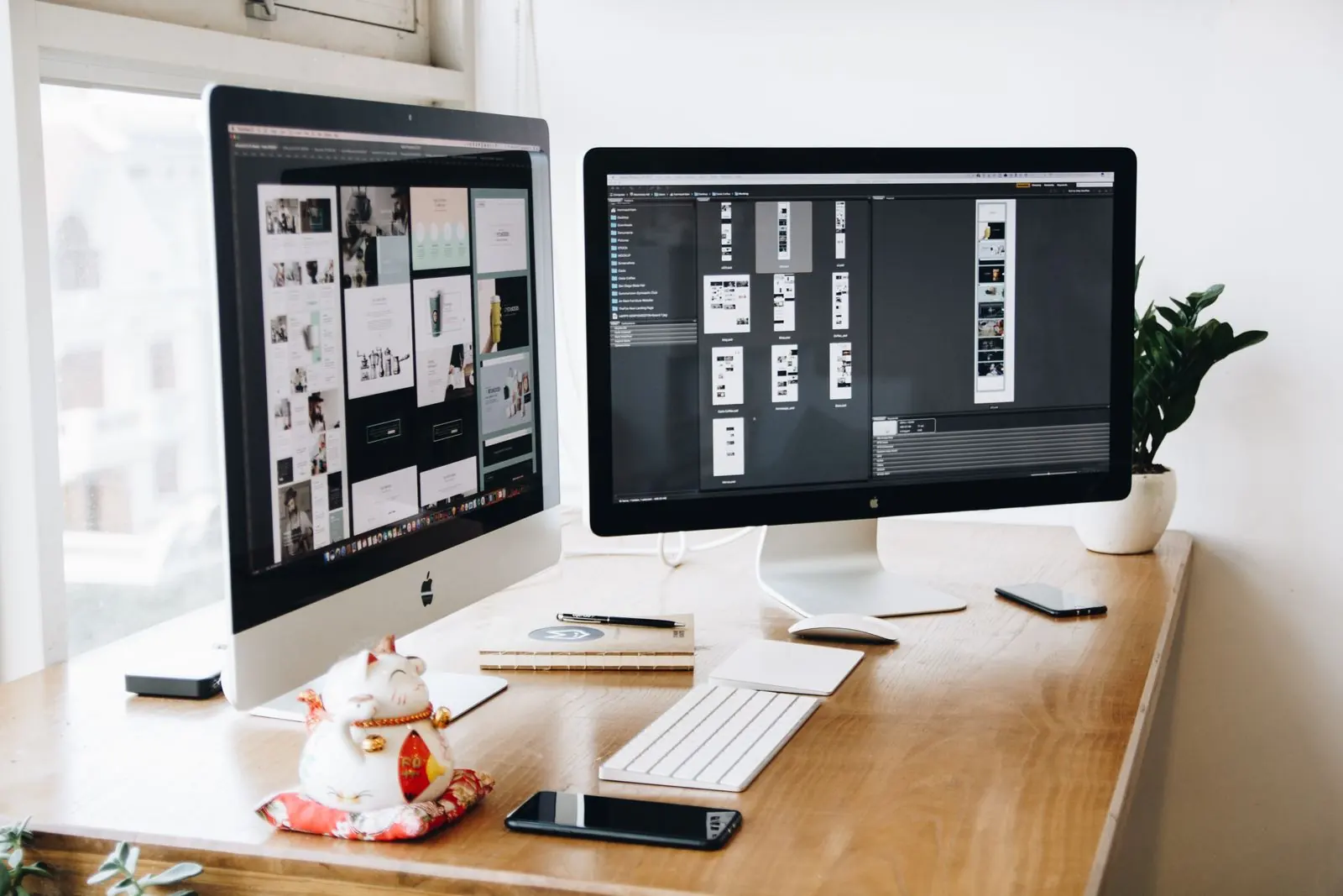 Website layouts appear on two monitors above a desk with a keyboard and illustrated cup.